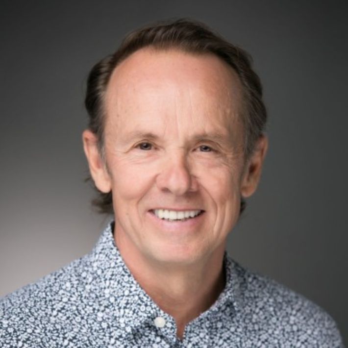 Smiling middle-aged man in patterned shirt