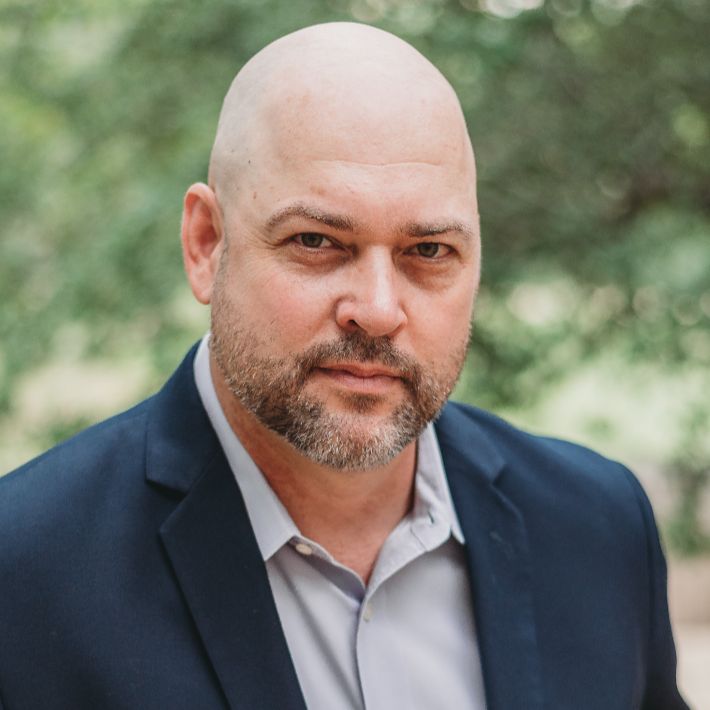 Bearded bald man in suit outdoor portrait